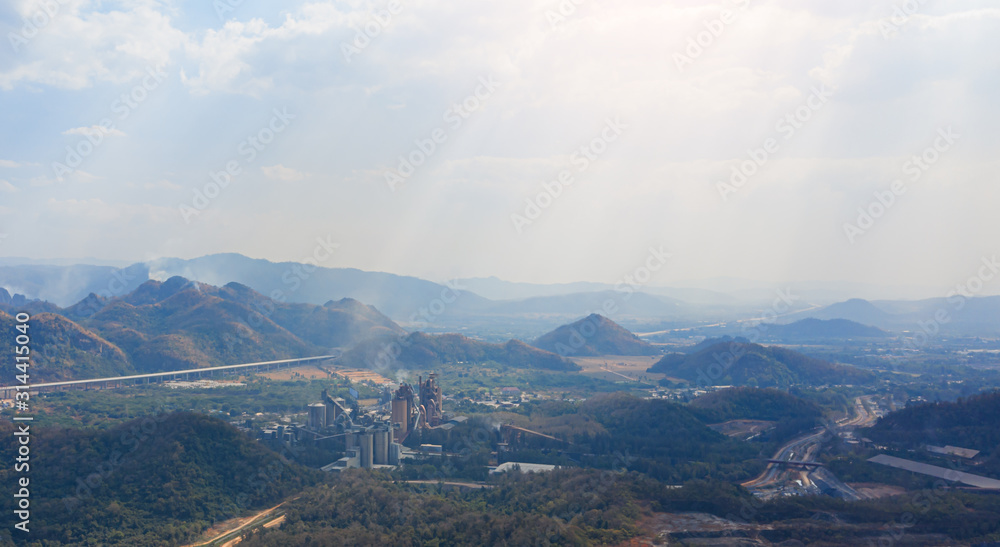 Aerial view of cement factory between the mountain.
