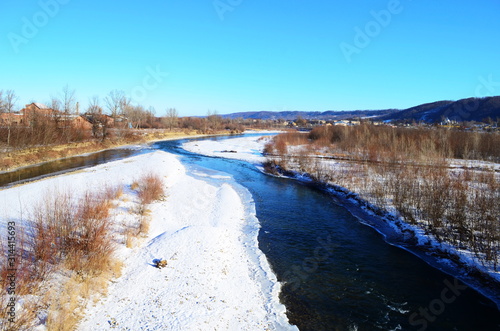 Winter landscape with the river and in frosty day