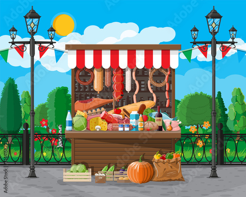 Traditional market wooden food stall full of food with flags, crates. City park, street lamp and trees. Sky with clouds and sun. Fair, grocery and shopping. Vector illustration flat style