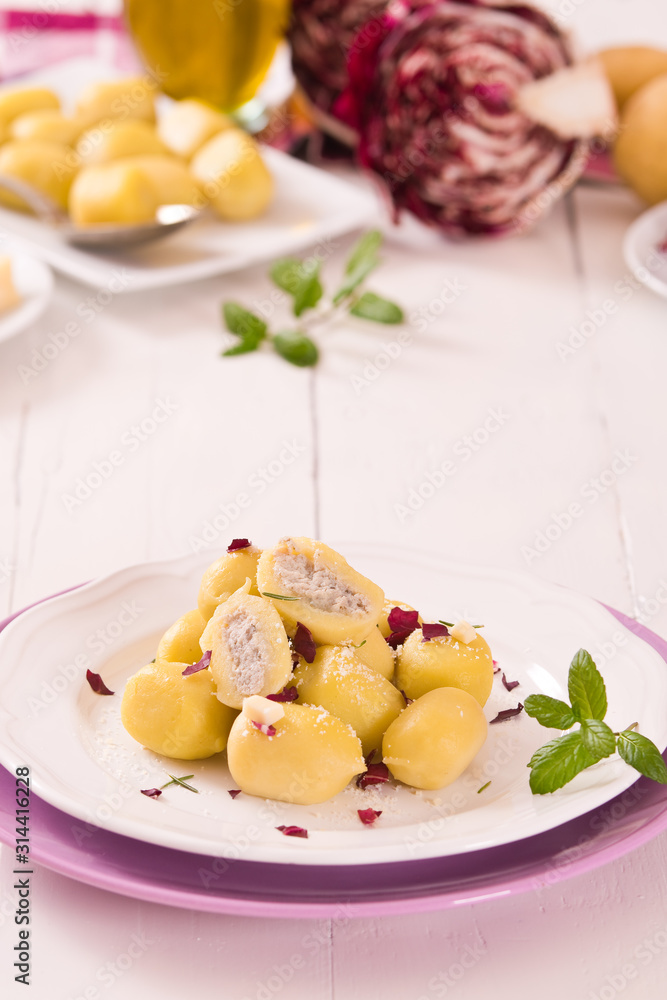 Potato gnocchi stuffed with radicchio and ricotta. Potato gnocchi stuffed with radicchio and ricotta.
