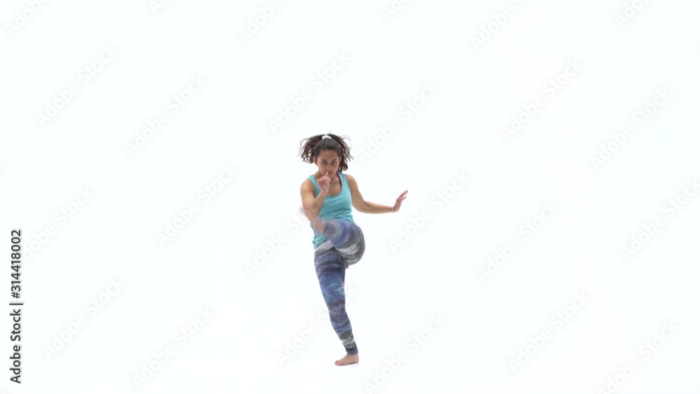 Females is practicing capoeira in white background of studio. Afro-Brazilian martial art that combine elements of dance. Silhouette of a strong slim figure. Females is practicing capoeira in white background of studio. Afro-Brazilian martial art that combine elements of dance. Silhouette of a strong slim figure.