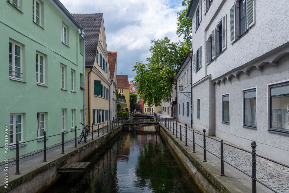Water channel passing trough the city of the old German town Memmingen