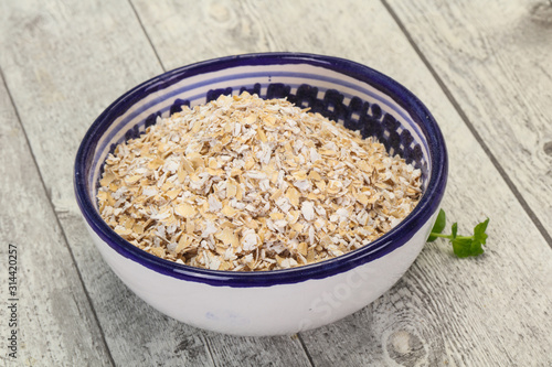 Raw oats in the bowl