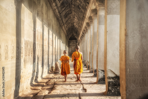 View of the two neophytes walking inside an Angkor Wat, Siem Reap, Cambodia.