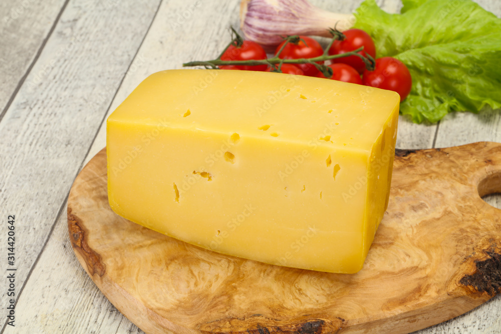 Hard yellow tasty cheese brick Hard yellow tasty cheese brick