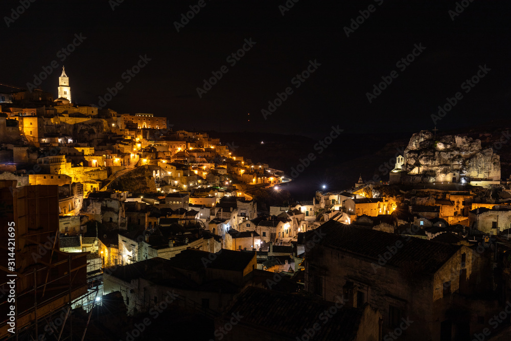 Night landscape of the Sassi of Matera, well-known for their ancient cave dwellings. Basilicata. Italy