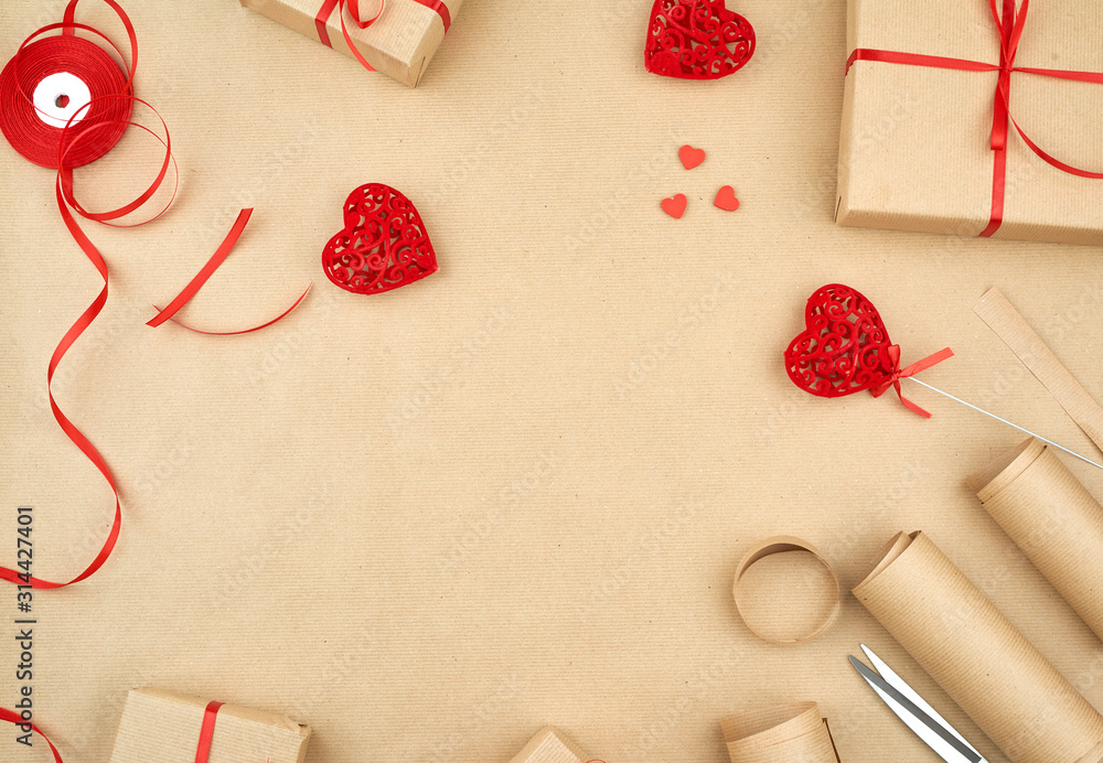 brown kraft paper, packed gift bags and tied with a red ribbon, red heart brown kraft paper, packed gift bags and tied with a red ribbon, red heart