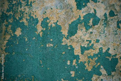 Texture of an old wall covered with paint. Background image of a worn paint coated surface © Сергей Щепанкевич