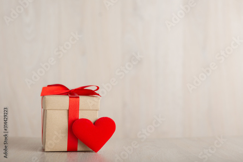 Valentine's Day Concept Gift box and heart on the wooden table