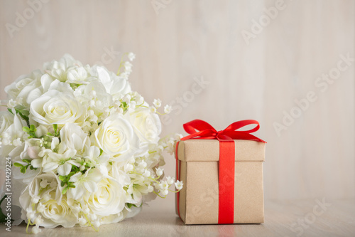 Valentine s Day Concept Gift box and flower on the wooden table