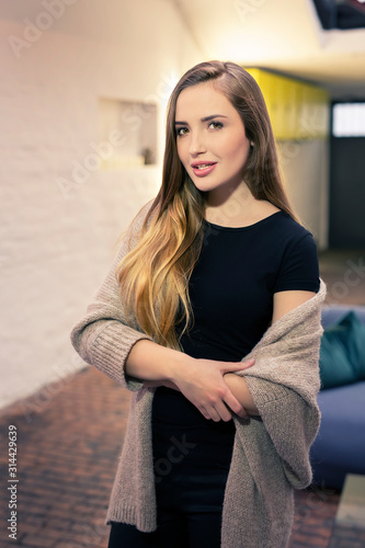 Young brunette woman feeling cozy at home