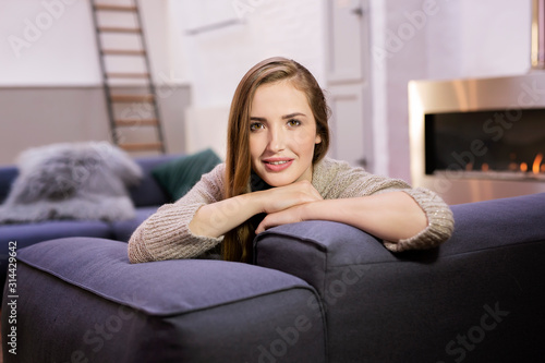 Young beautiful woman in cozy home