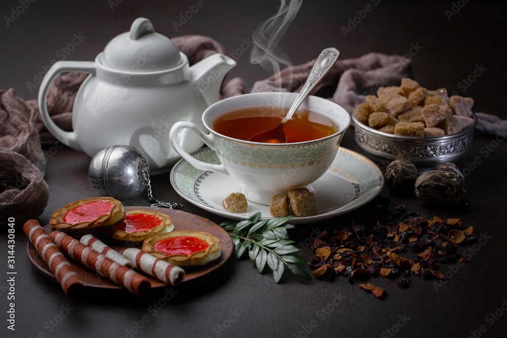 Tea hot drink on old background in composition on the table Tea hot drink on old background in composition on the table