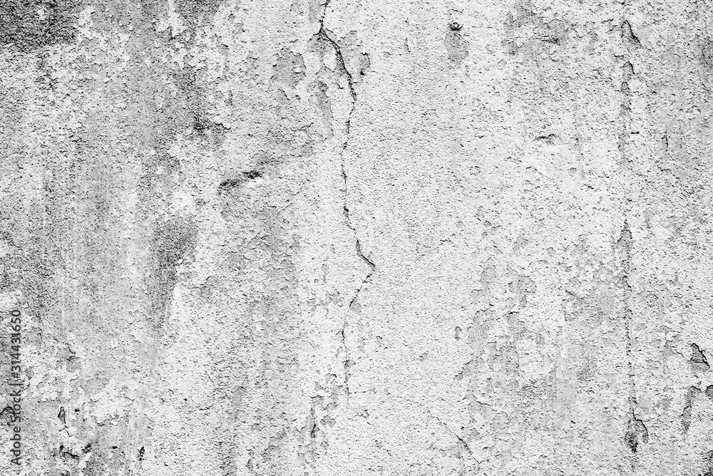 Obraz premium Tekstura betonowej ściany z pęknięciami i zadrapaniami, które mogą służyć jako tło