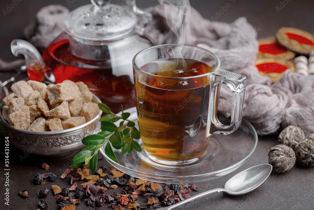 Tea hot drink on old background in composition on the table Tea hot drink on old background in composition on the table