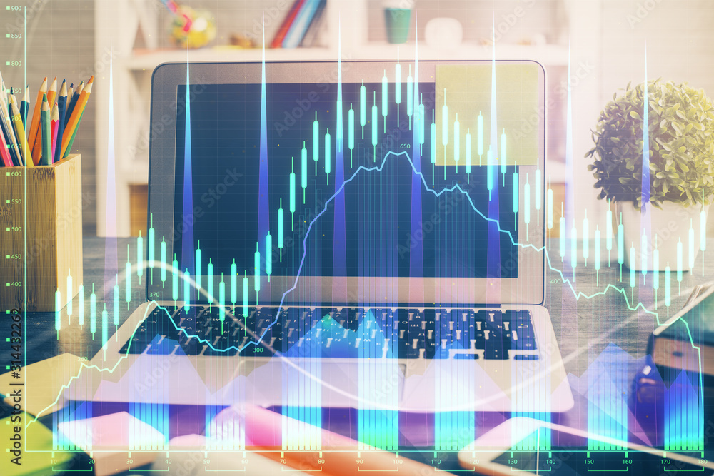 Financial graph colorful drawing and table with computer on background. Double exposure. Concept of international markets. Financial graph colorful drawing and table with computer on background. Double exposure. Concept of international markets.
