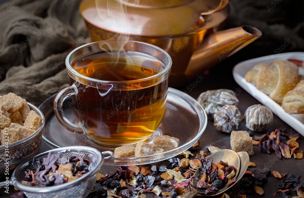Tea hot drink on old background in composition on the table Tea hot drink on old background in composition on the table