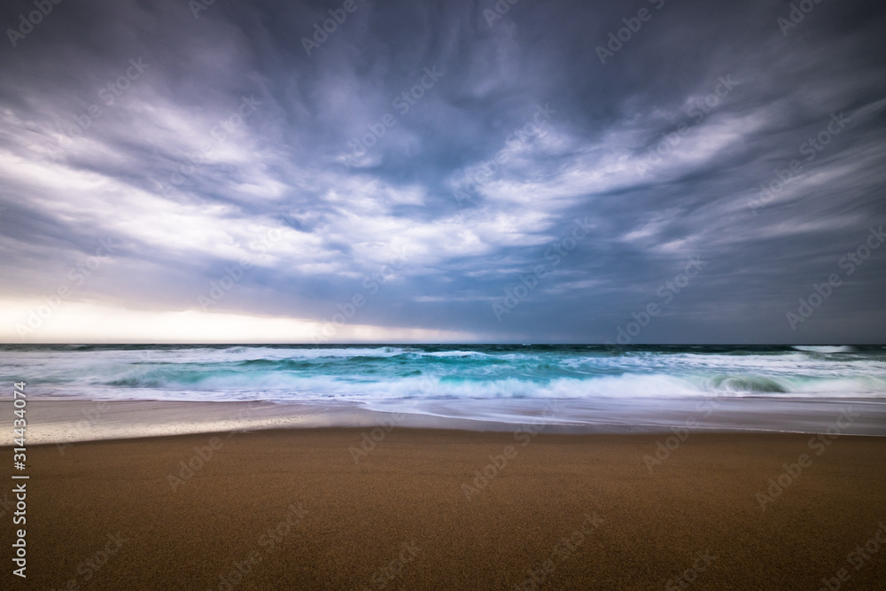 Dramatic storm clouds on a rainy day over the ocean at a beach in rhode island usa Dramatic storm clouds on a rainy day over the ocean at a beach in rhode island usa