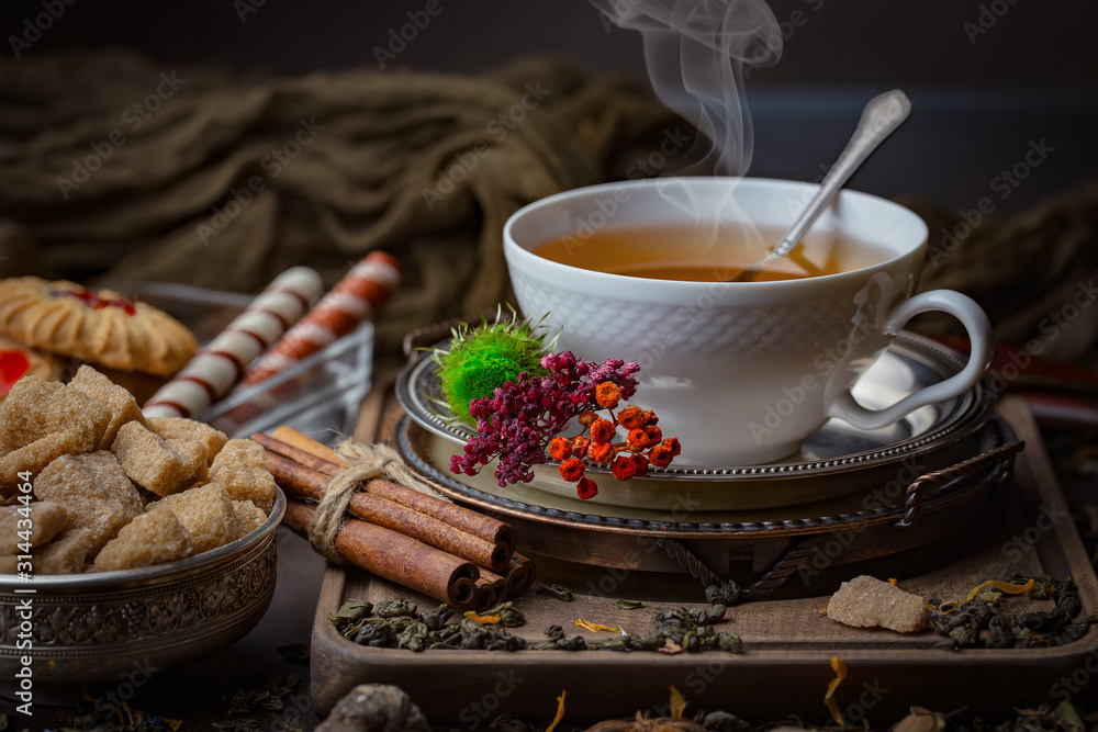 Tea hot drink on old background in composition on the table Tea hot drink on old background in composition on the table