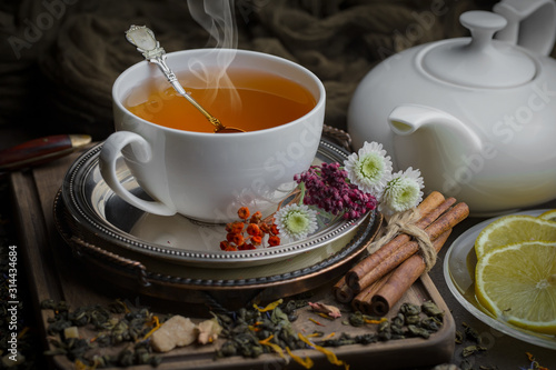 Tea hot drink on old background in composition on the table