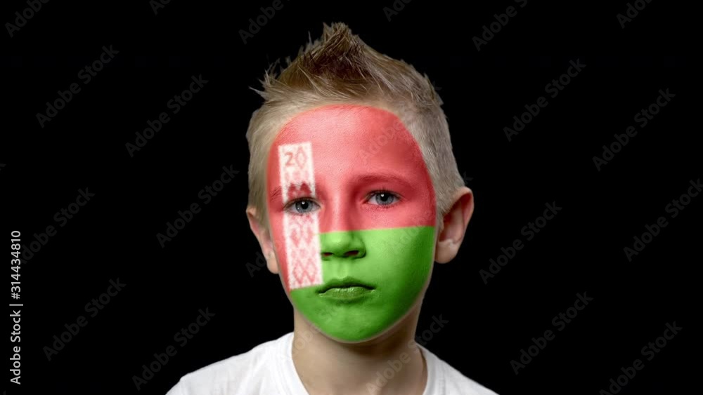 Sad fan of the football team of Belarus. A child with a face painted in national colors. Unhappy boy with sad eyes. Fiasco of your favorite team. Disappointment. Sadness. Experience. Failure. Bad luck Sad fan of the football team of Belarus. A child with a face painted in national colors. Unhappy boy with sad eyes. Fiasco of your favorite team. Disappointment. Sadness. Experience. Failure. Bad luck