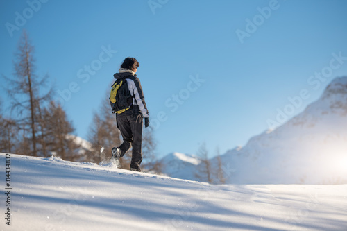 Winter sports walk in the snow on the Alps