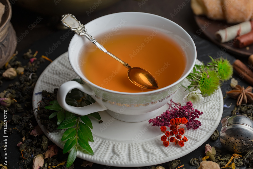 Tea hot drink on old background in composition on the table Tea hot drink on old background in composition on the table