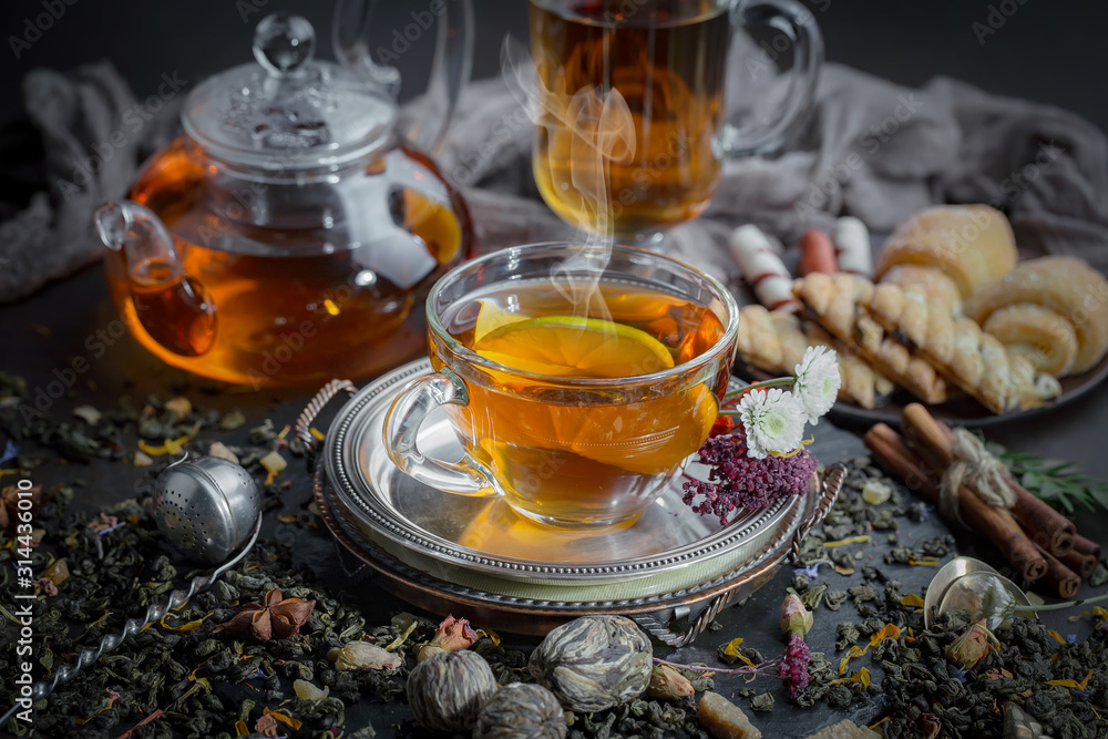 Tea hot drink on old background in composition on the table Tea hot drink on old background in composition on the table