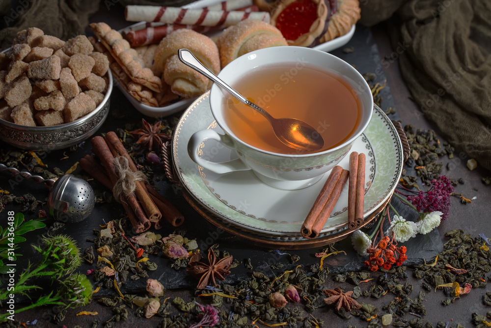 Tea in a cup on an old background Tea in a cup on an old background