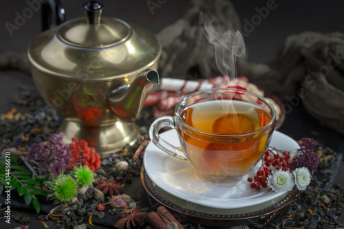 Tea hot drink on old background in composition on the table