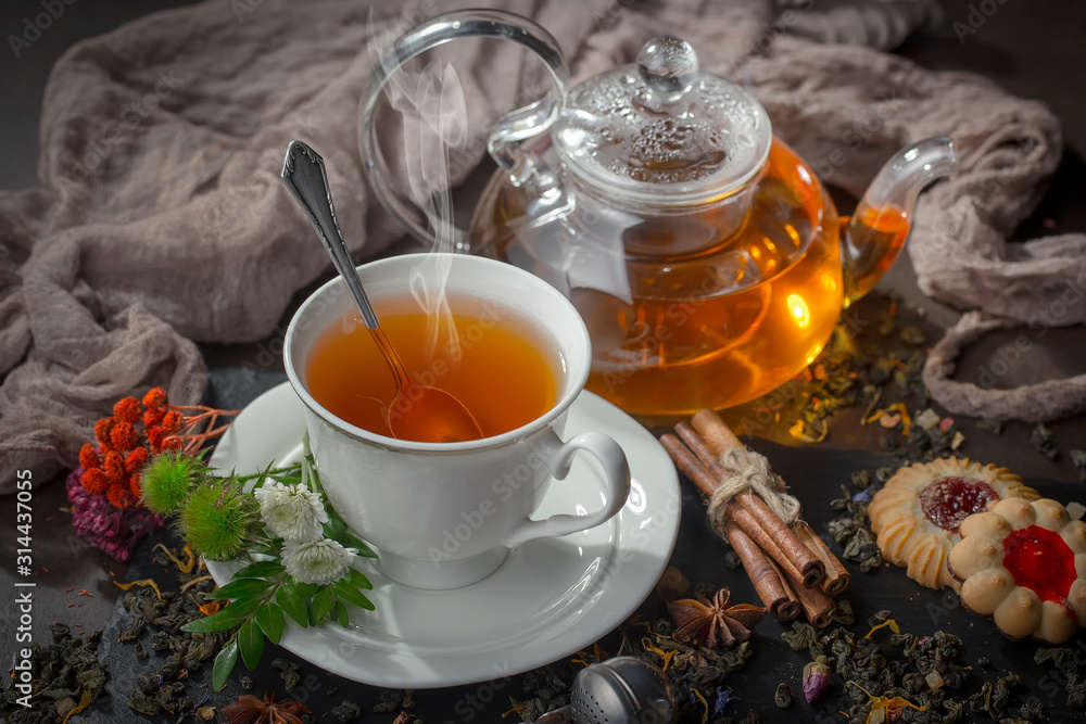Tea hot drink on old background in composition on the table Tea hot drink on old background in composition on the table
