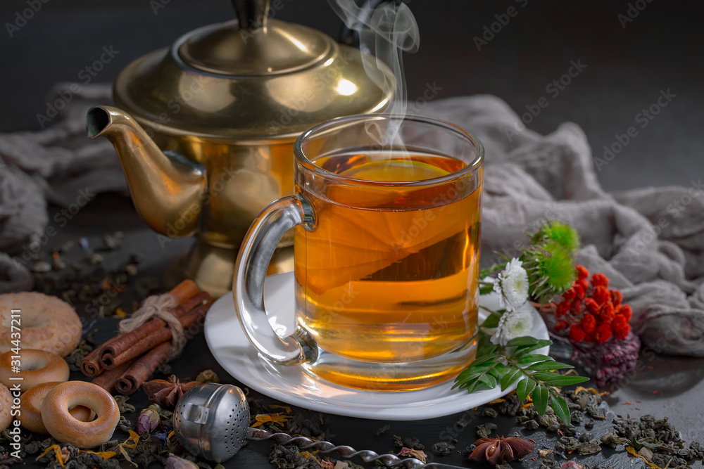 Tea hot drink on old background in composition on the table Tea hot drink on old background in composition on the table