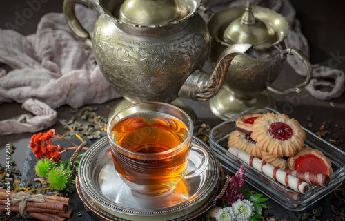 Tea hot drink on old background in composition on the table