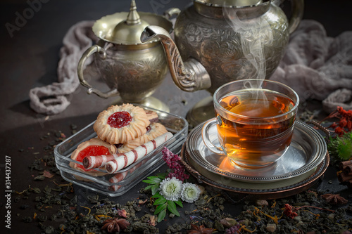 Tea hot drink on old background in composition on the table