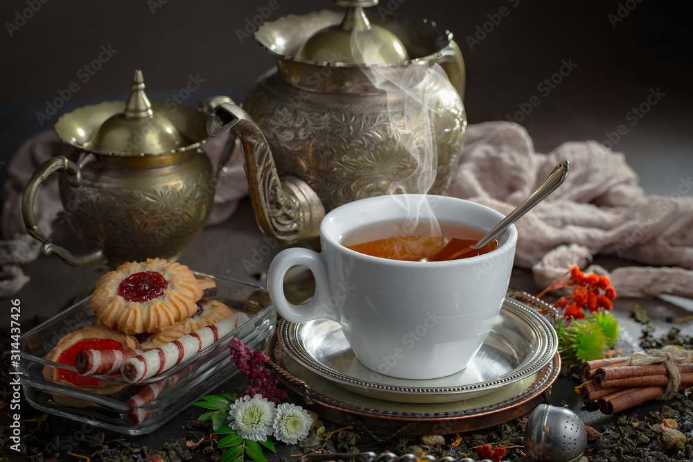 Tea in a cup on an old background Tea in a cup on an old background