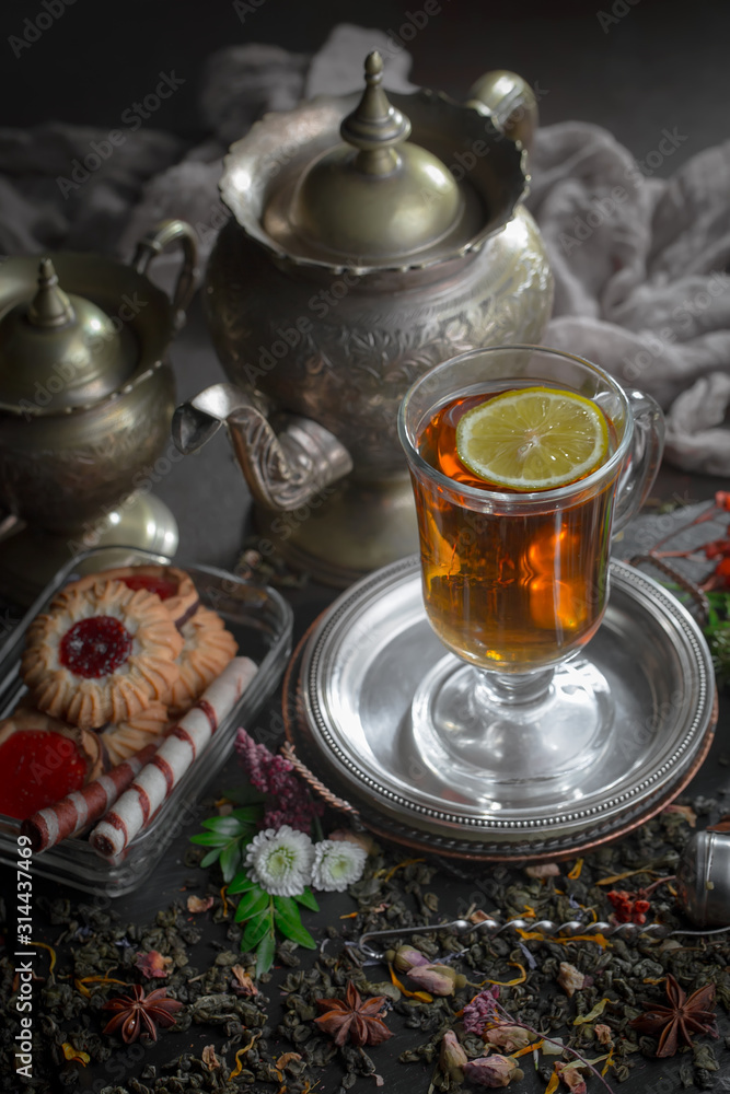 Tea hot drink on old background in composition on the table Tea hot drink on old background in composition on the table