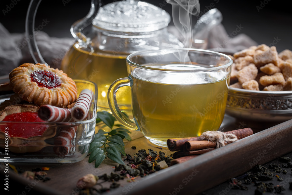Tea hot drink on old background in composition on the table Tea hot drink on old background in composition on the table