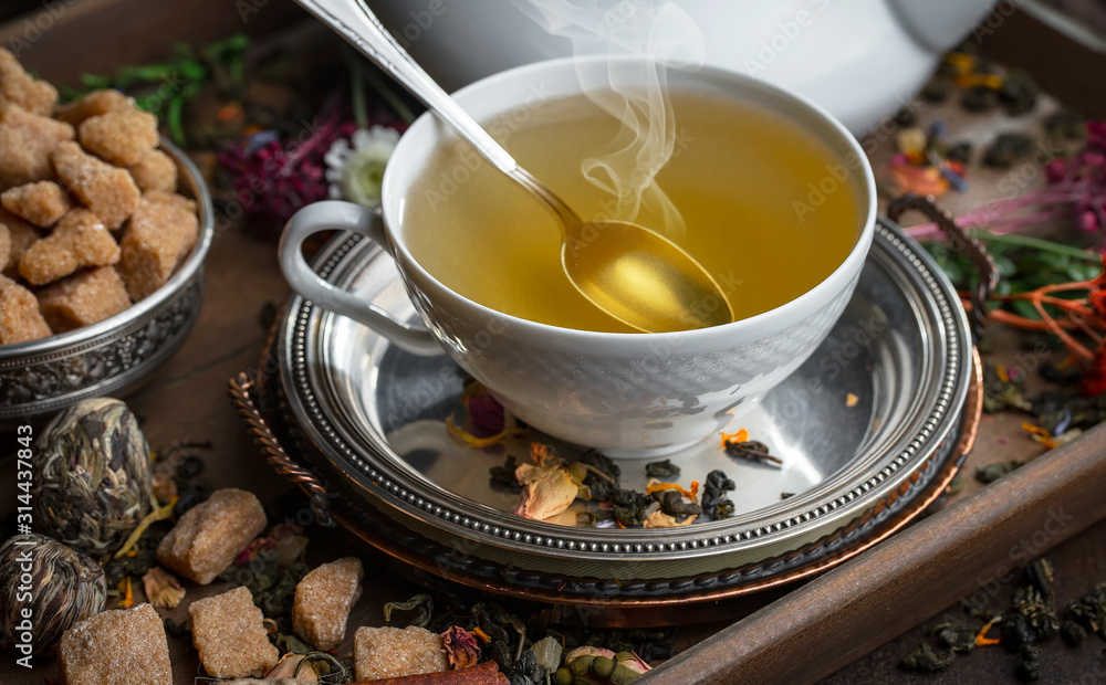 Tea hot drink on old background in composition on the table Tea hot drink on old background in composition on the table
