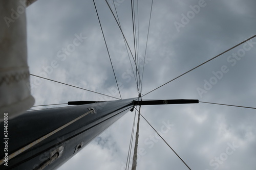 Close up of sailing boat at sea, the main mast seen from below.