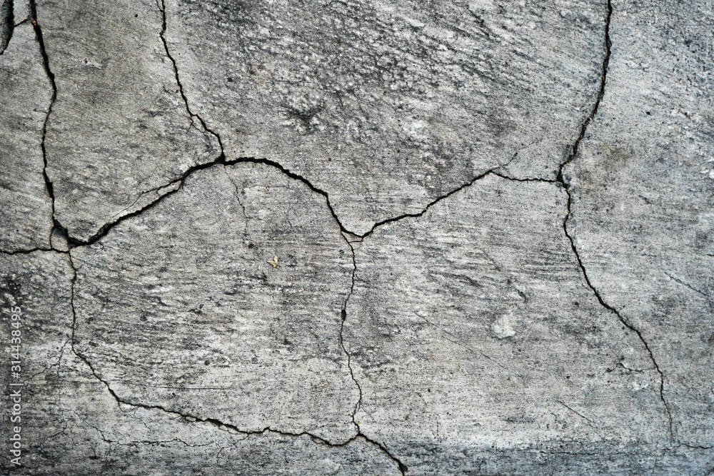 Obraz premium Texture of an old cracked concrete wall. Background image of a worn gray concrete surface