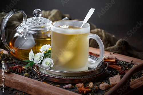 Tea hot drink on old background in composition on the table