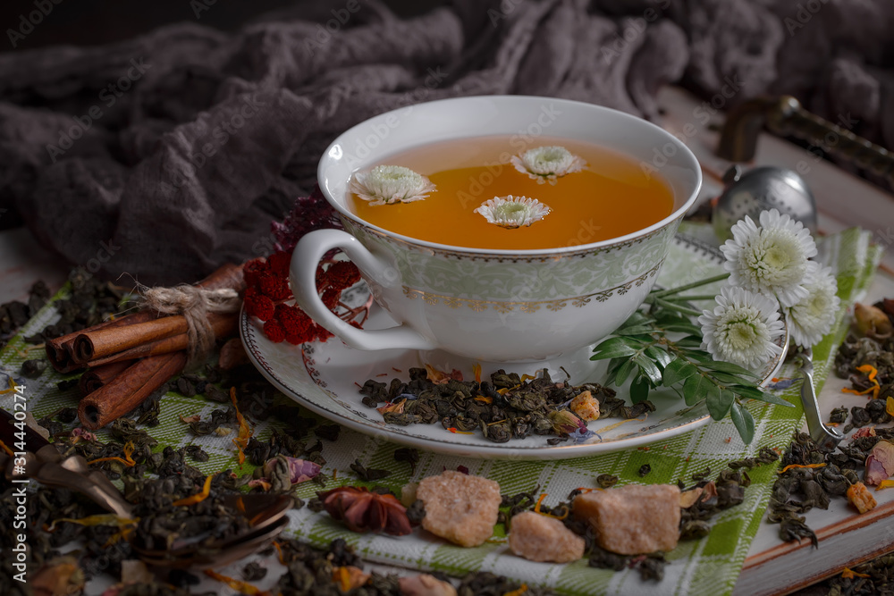 Tea hot drink on old background in composition on the table Tea hot drink on old background in composition on the table