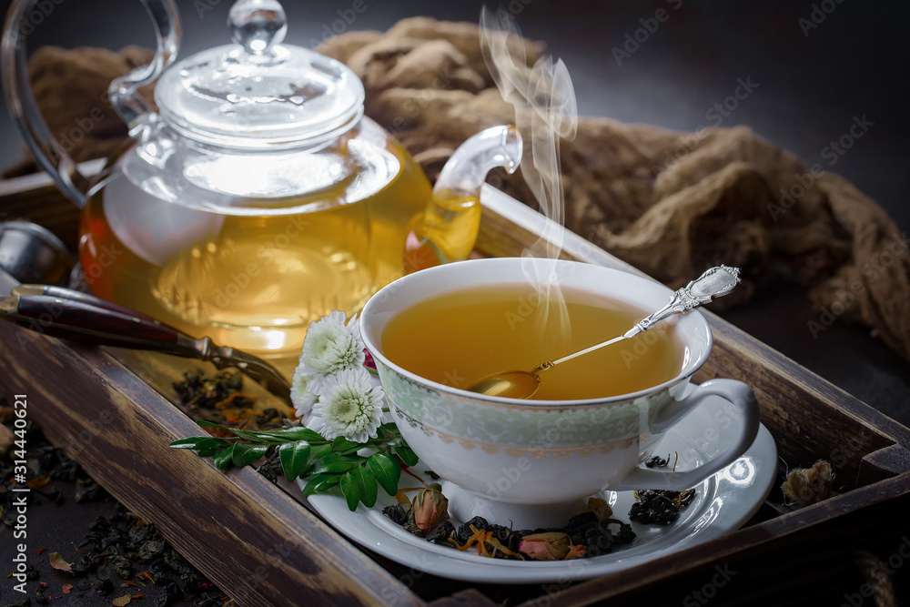 Tea hot drink on old background in composition on the table Tea hot drink on old background in composition on the table