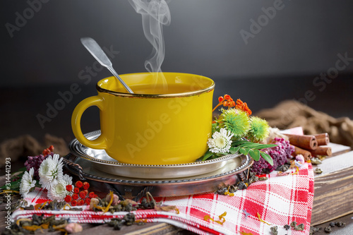 Tea hot drink on old background in composition on the table photo