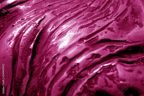 Metal rough surface with blur effect in pink tone.