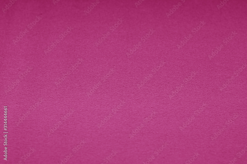 Fototapeta premium Plastic glittering texture with blur effect in pink tone.
