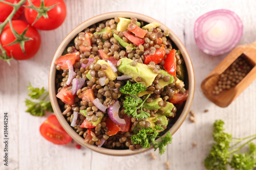 lentils salad with avocado, tomato, onion and sauce