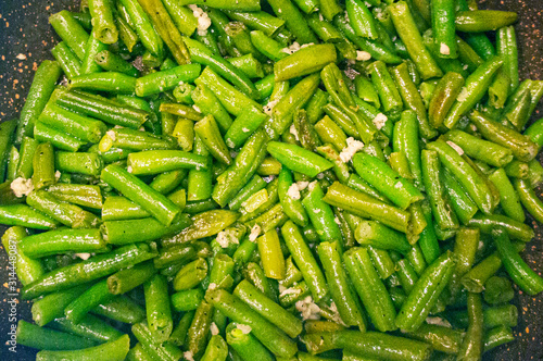 Fototapeta Naklejka Na Ścianę i Meble -  Green beans in a pan close-up. Vegan food.