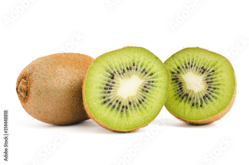 Two round slice halves kiwi and whole tropical fruit isolated on white background