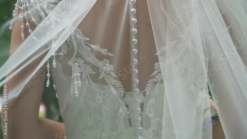 details of the bride in the wedding dress